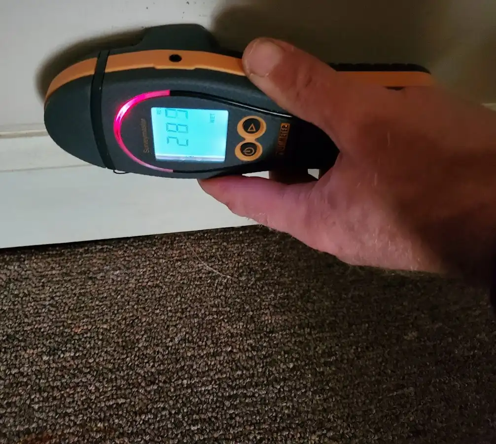 Moisture detection at baseboard during Storm Damage Restoration in Lancaster